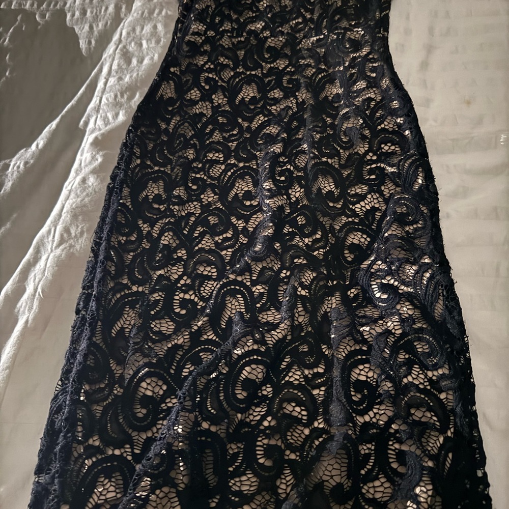 Retro black lace dress with nude slip beneath
